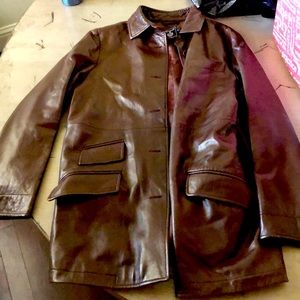 Dark brown leather jacket. Medium length.